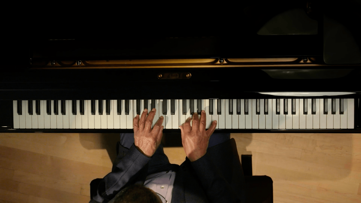 A snapshot of Herbie Hancock's playing the piano in his MasterClass